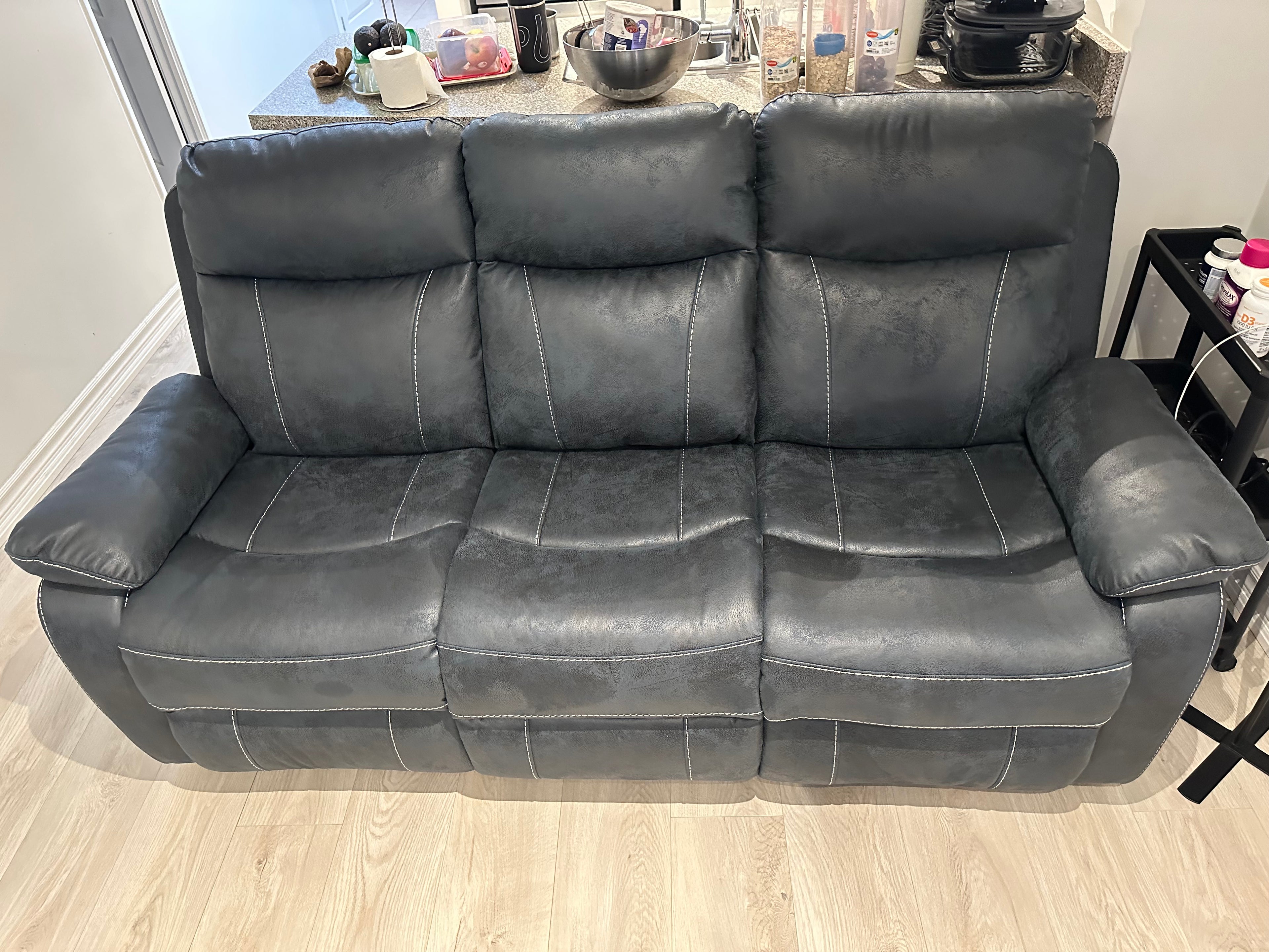 Reclining sofa with center console and 2 Cup holders
