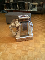 Pair of vintage ceramic elephants can be used as end tables
