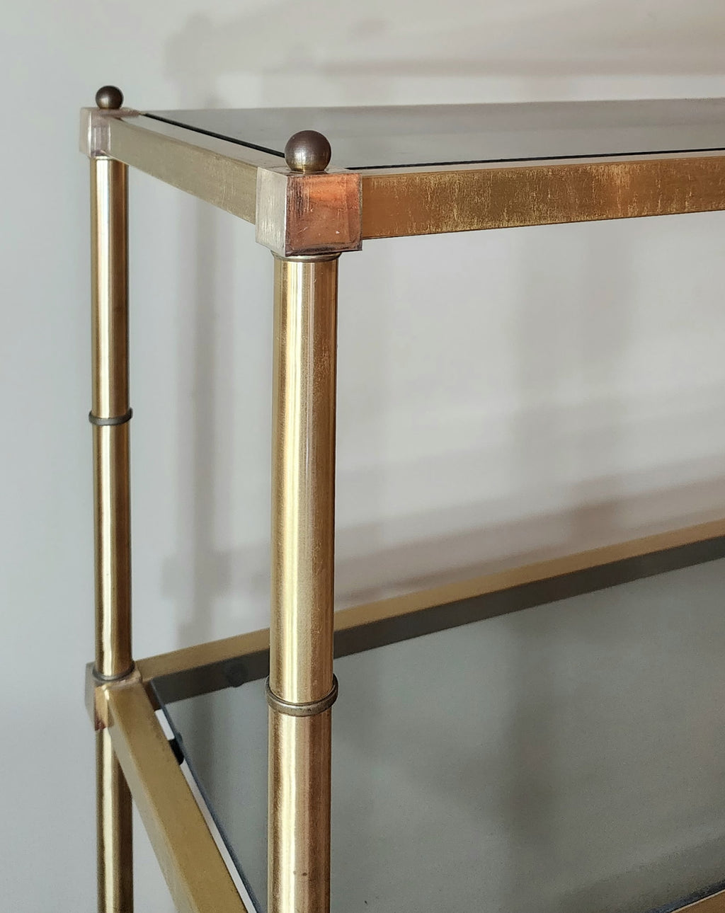 Hollywood Regency brass and smoked glass étagère