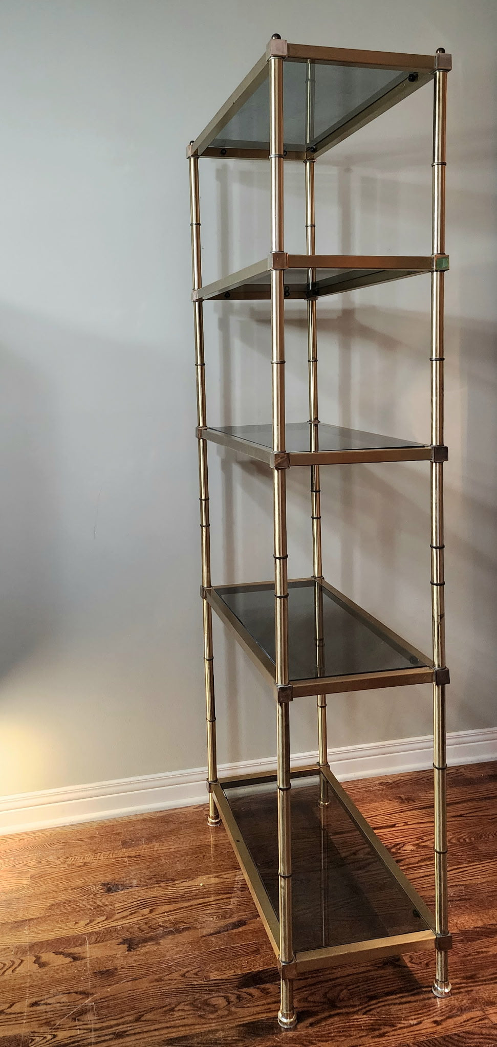 Hollywood Regency brass and smoked glass étagère