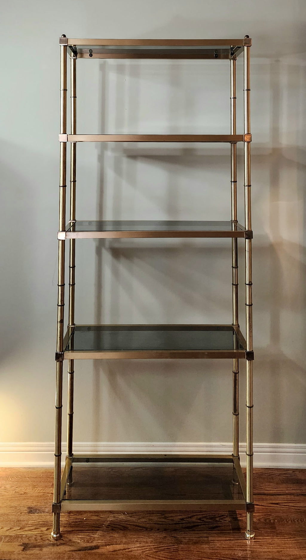 Hollywood Regency brass and smoked glass étagère