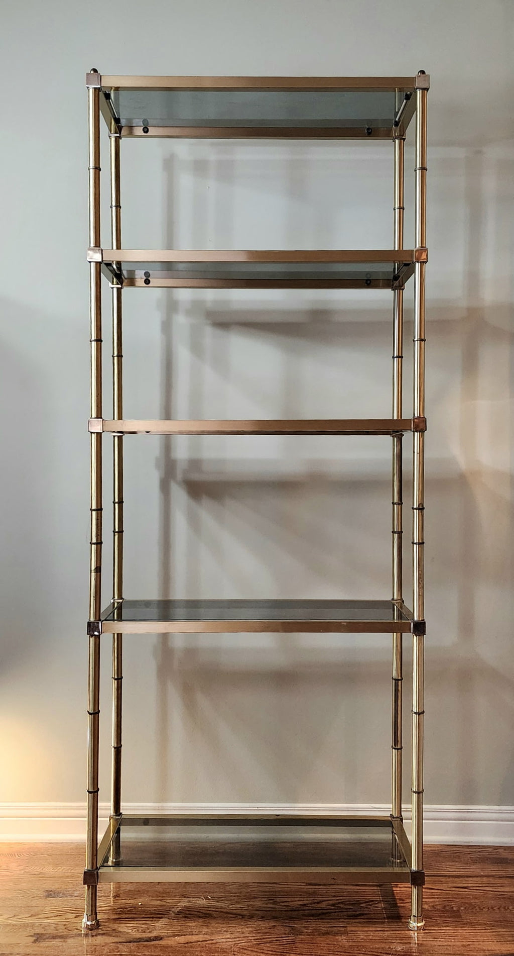 Hollywood Regency brass and smoked glass étagère