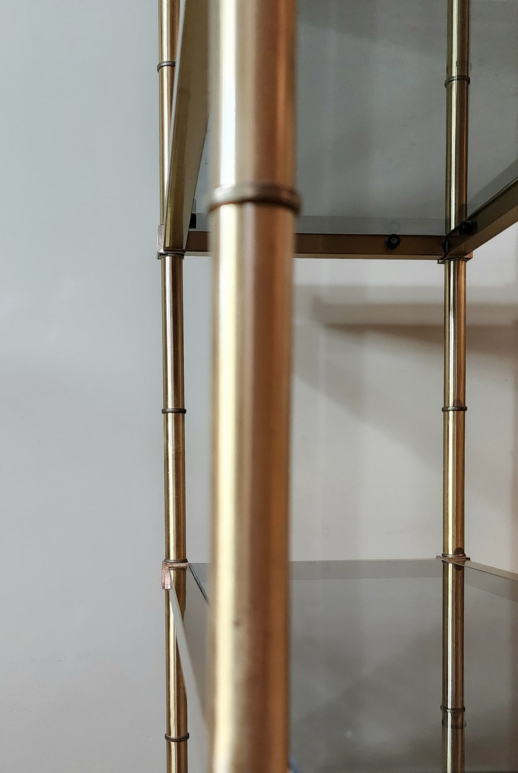 Hollywood Regency brass and smoked glass étagère
