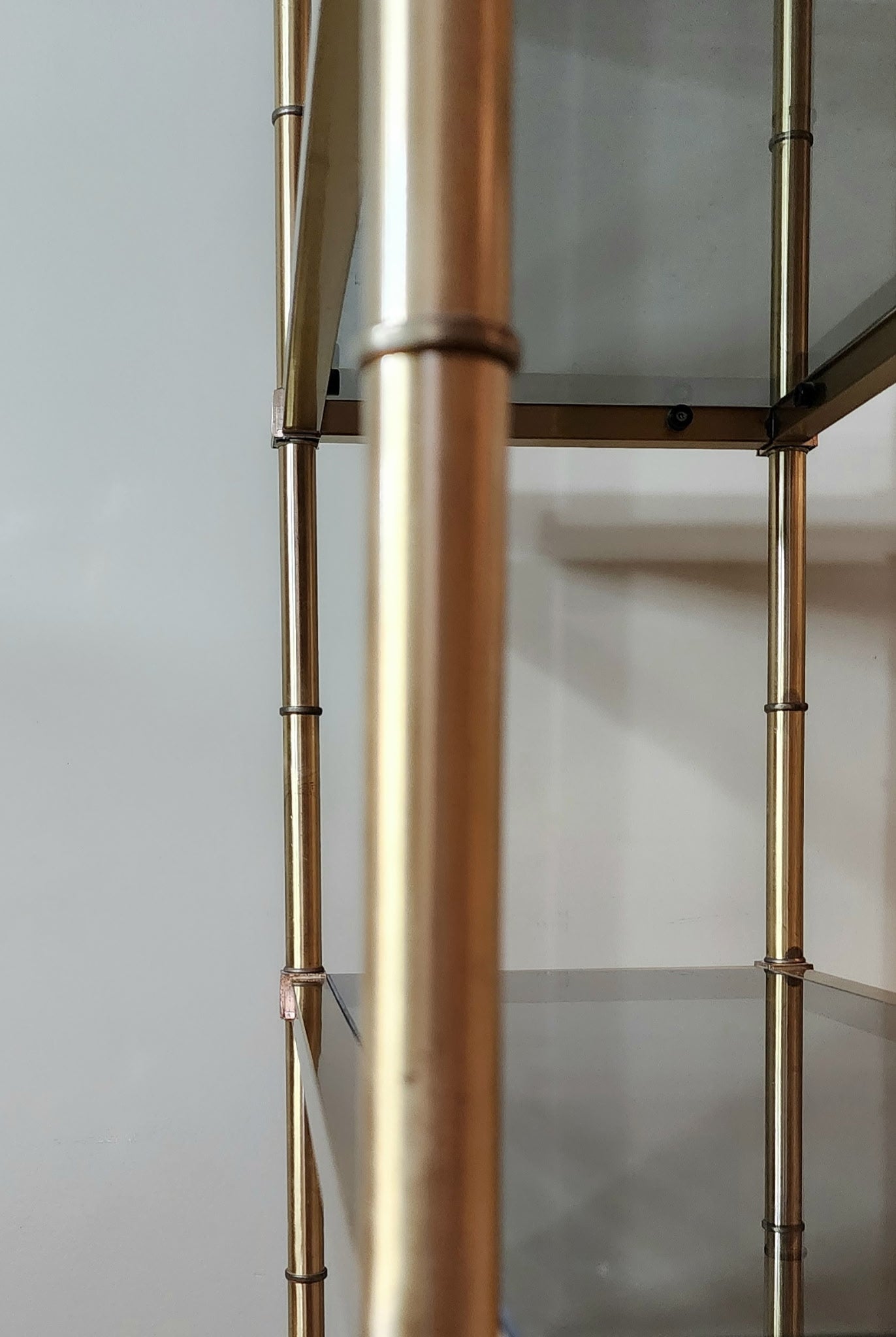 Hollywood Regency brass and smoked glass étagère