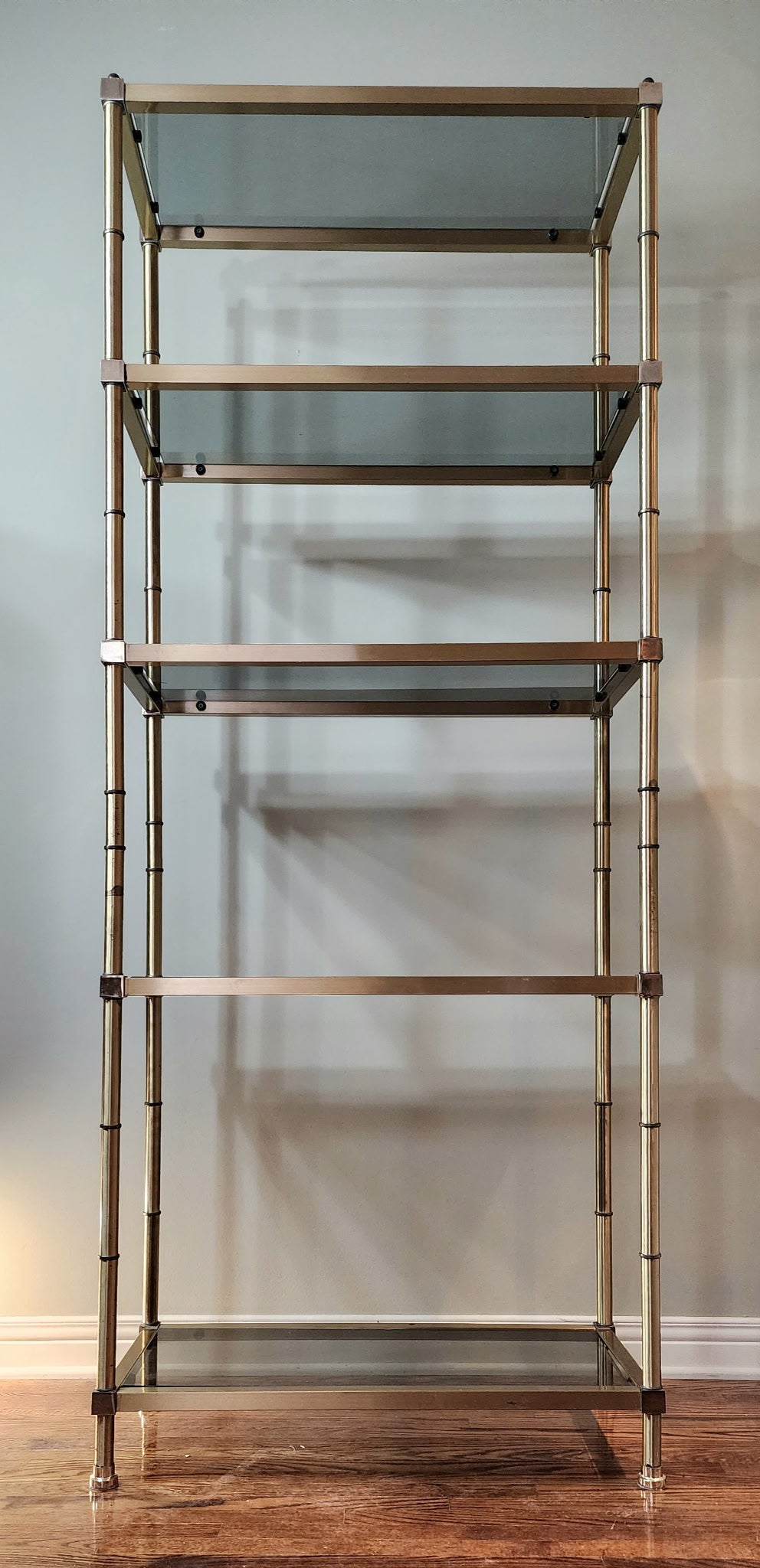 Hollywood Regency brass and smoked glass étagère