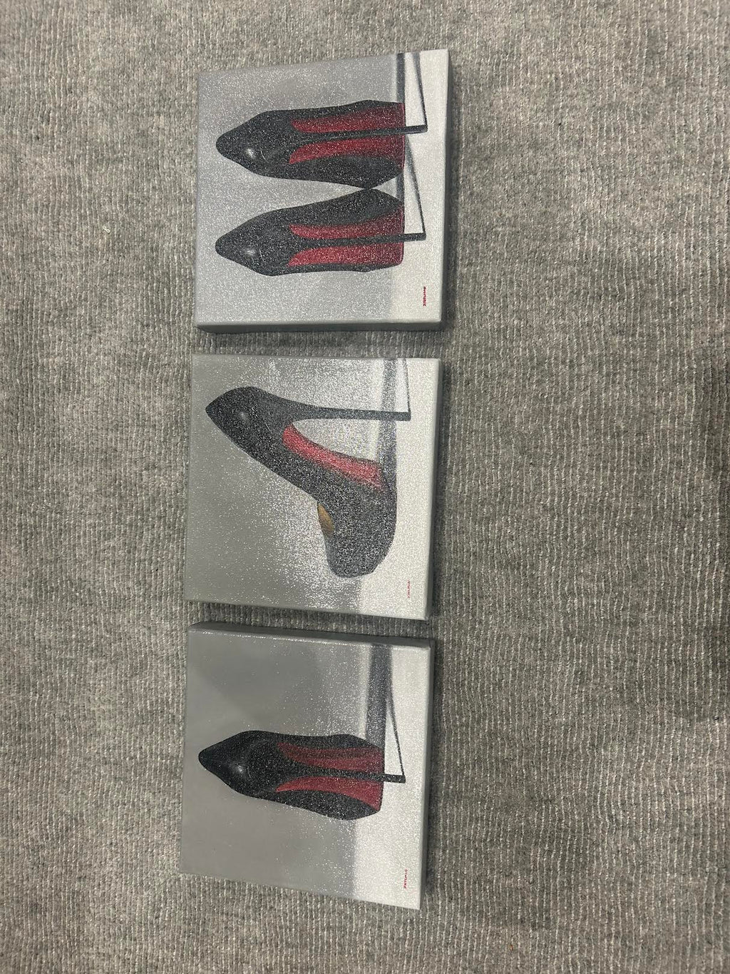 Straight-on view of all three Joanne Helman shoe paintings; each painting is listed separately