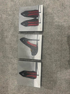 Straight-on view of all three Joanne Helman shoe paintings; each painting is listed separately