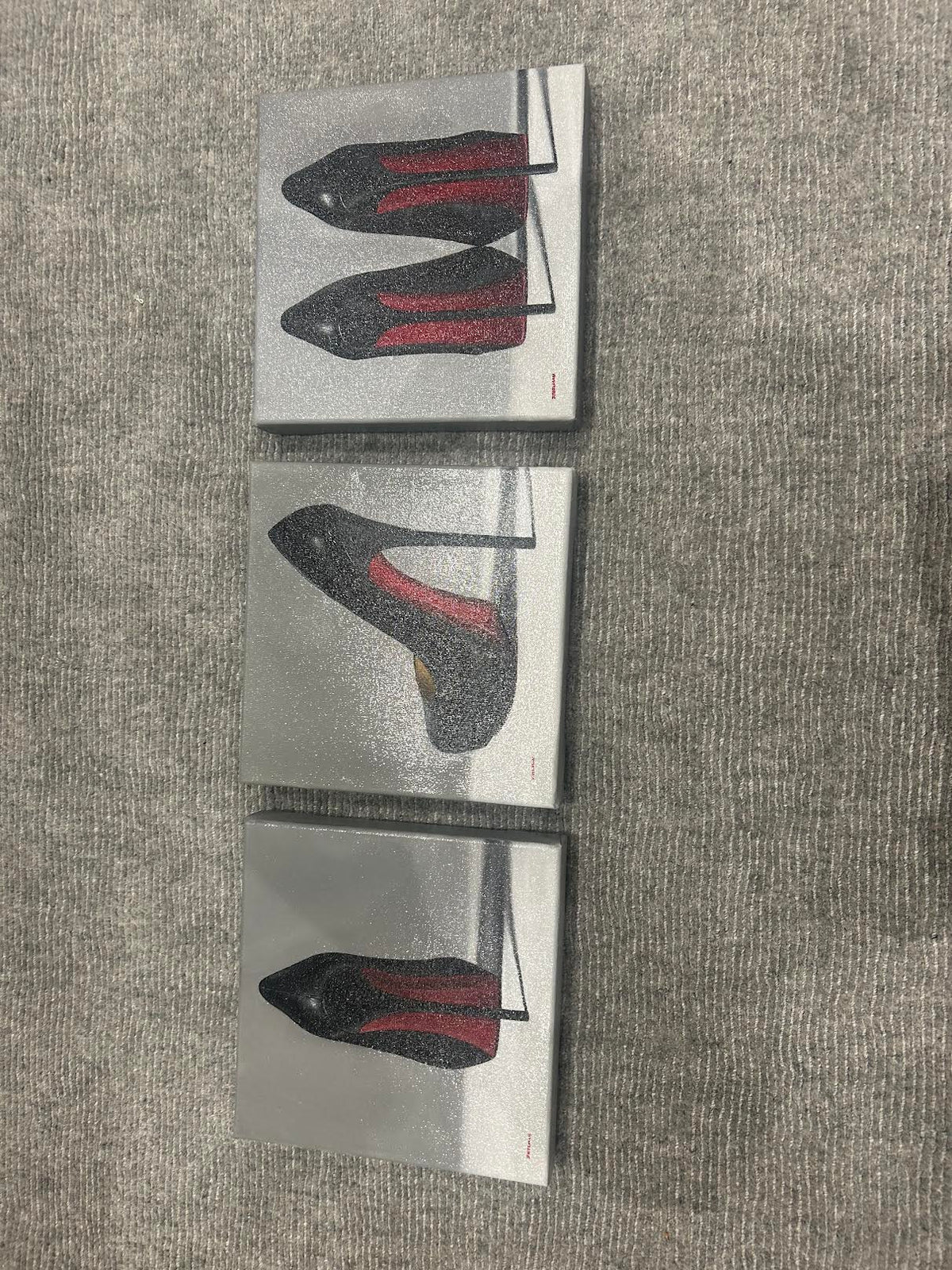 Straight-on view of all three Joanne Helman shoe paintings; each painting is listed separately